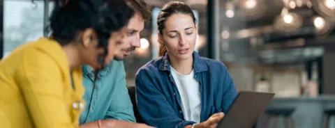 Small group of co-workers working together